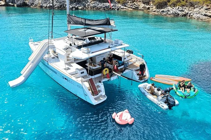 Catamaran at anchor in the Mirabello gulf on a Spinalonga cruise, Crete Greece
