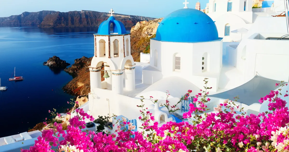 Whitewashed Oia above the caldera on a Santorini day trip from Crete, Greece