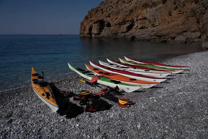 Sea kayaks below the cliffs of the Sfakia coast near Loutro, Crete Greece