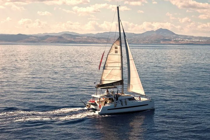 Catamaran at sunset off Hersonissos on a luxury sunset cruise, Crete Greece