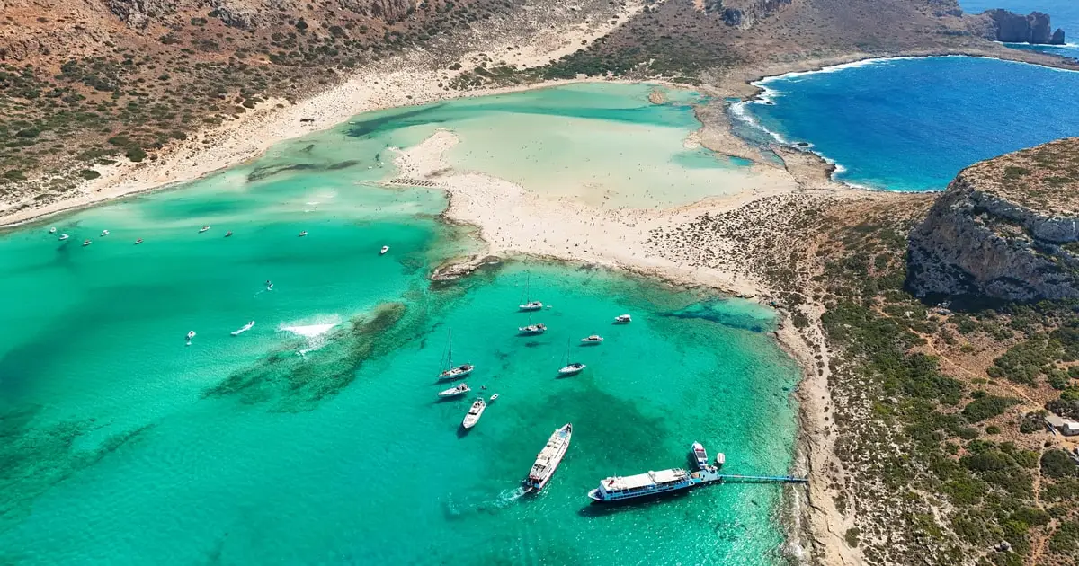 Boat anchored off Gramvousa island on a Balos lagoon cruise from Kissamos, Crete Greece