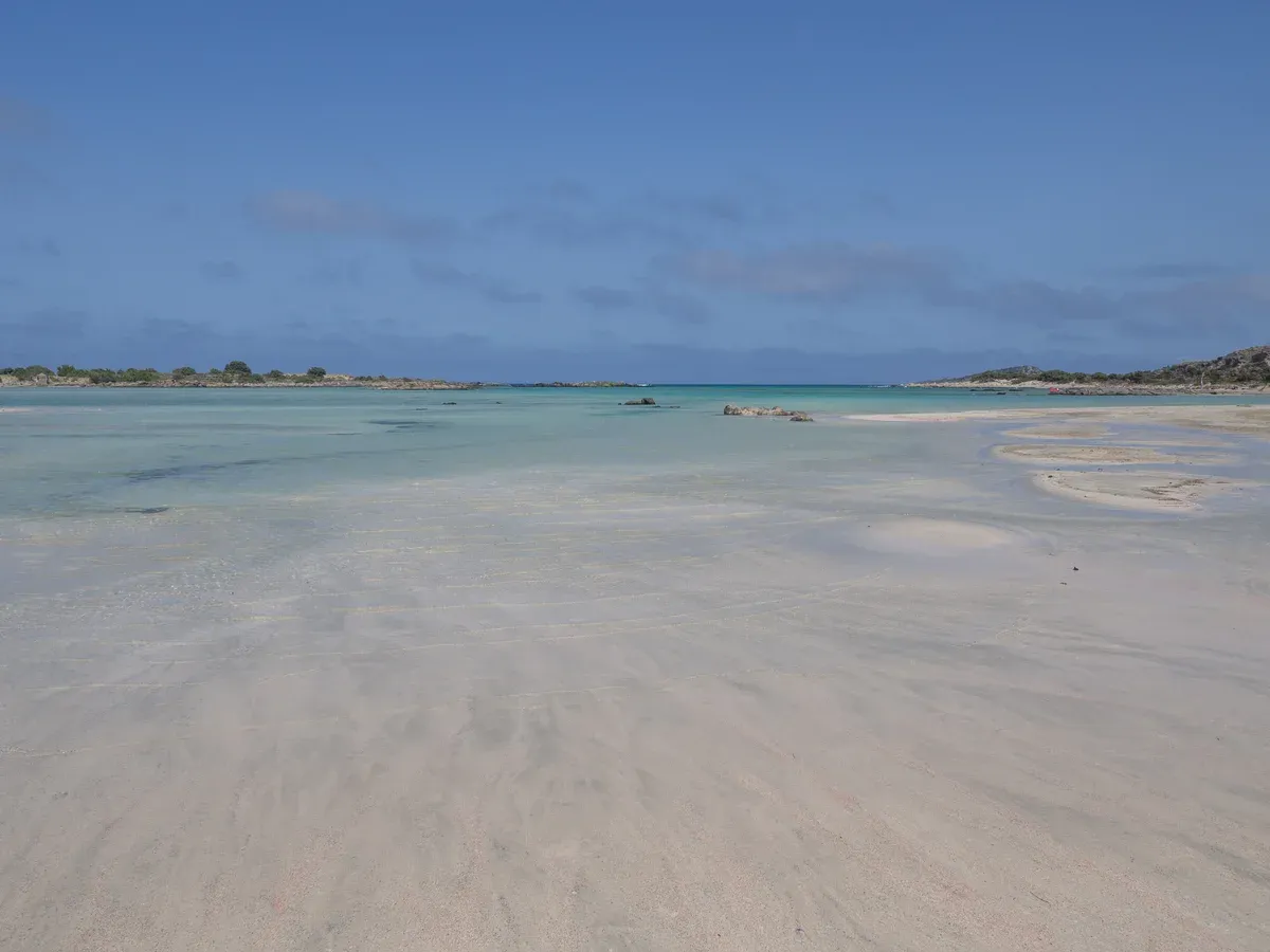 The pink-tinged shallow lagoon at Elafonisi, a Crete beaches highlight